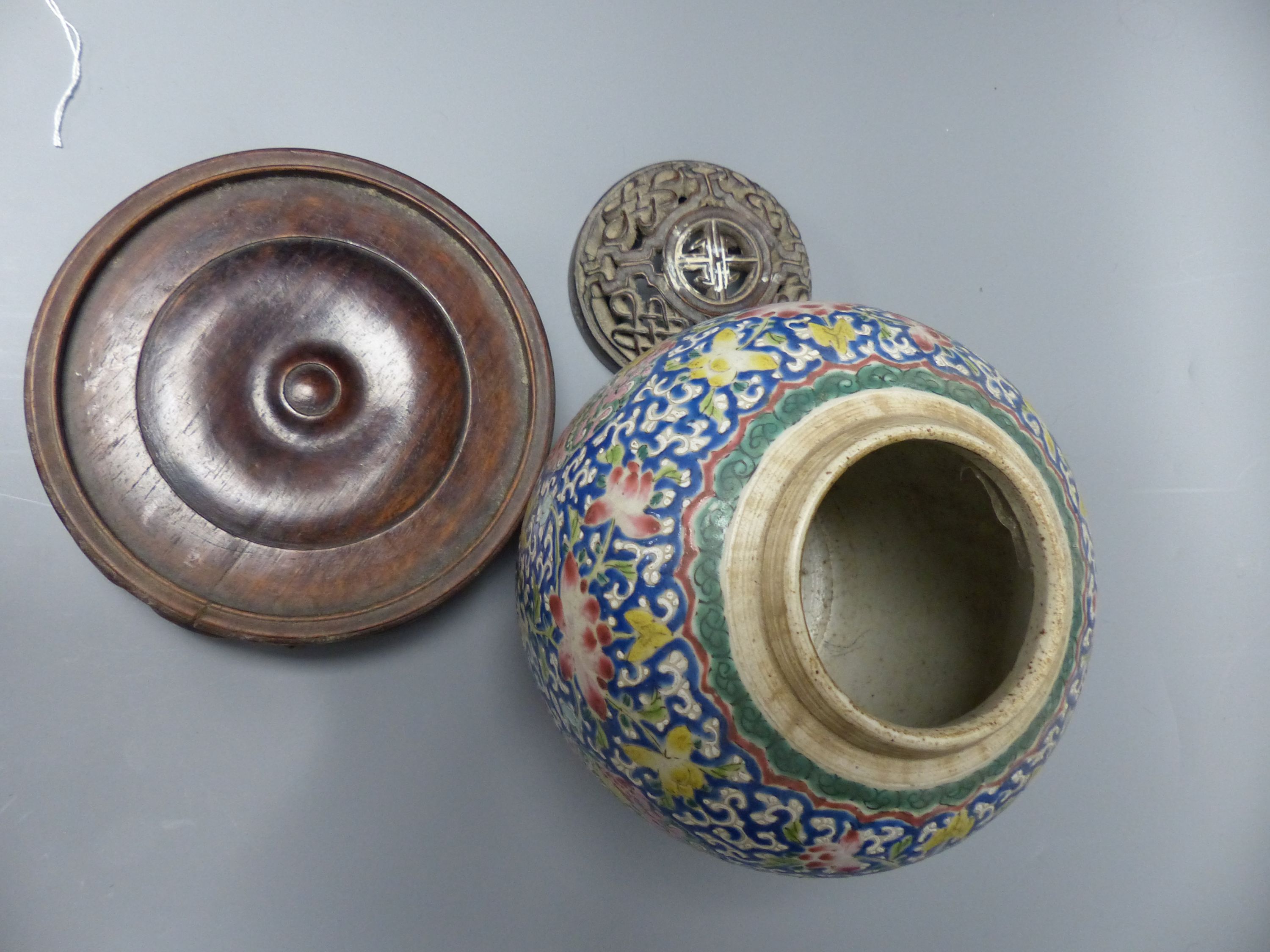 A 19th century Chinese enamelled jar with carved wood cover and stand, overall height 26cm